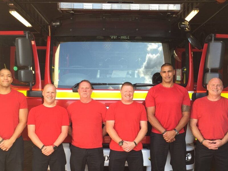 Crew of Firefighters outside a Fire engine