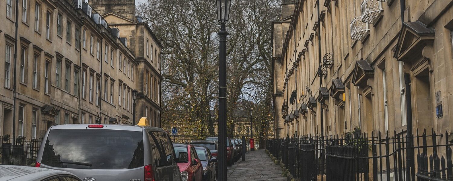 Residential street with cars parked along the pavement