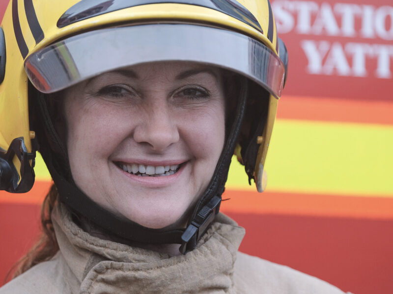 Female white firefighter in full kit