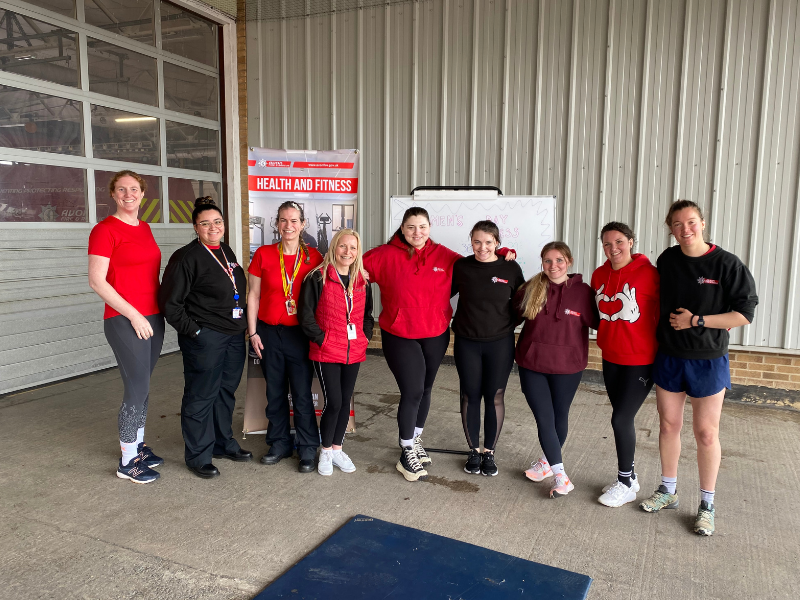 smiling female staff at fitness event