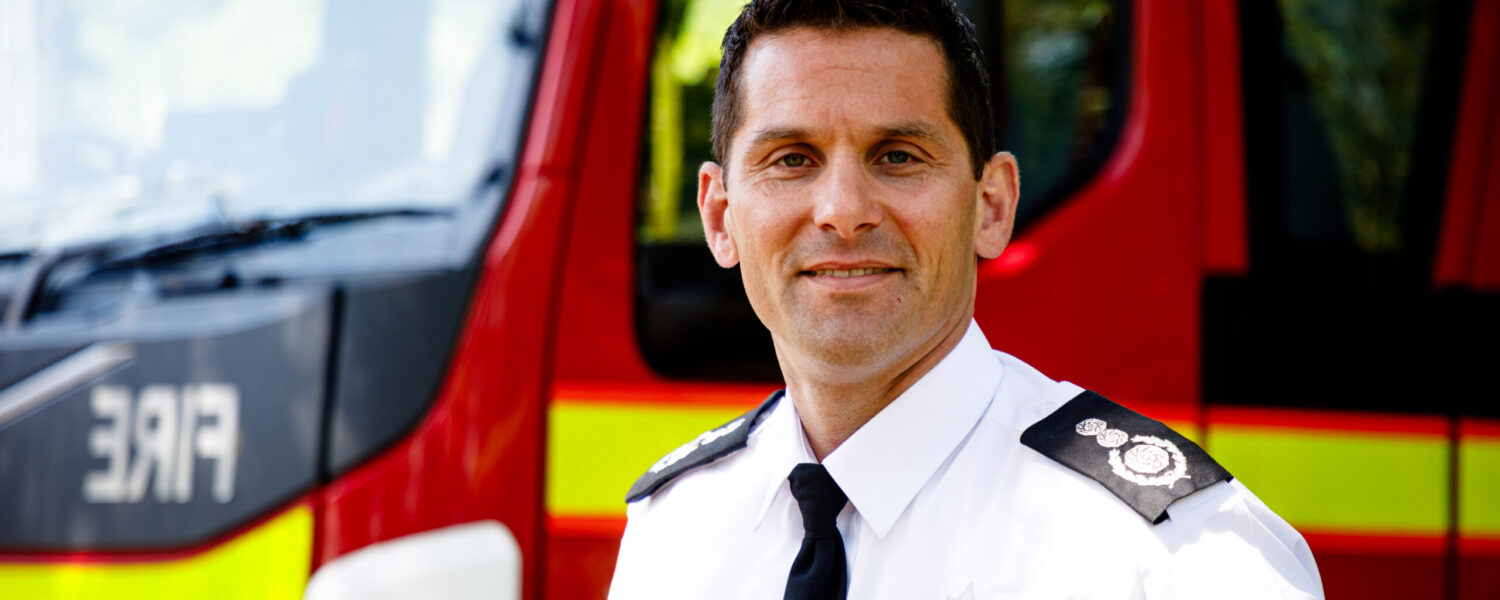 Chief Fire Officer Matt Cook stood in front of fire engine