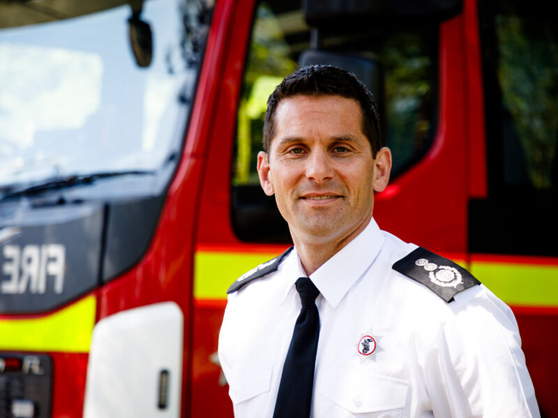 Chief Fire Officer Matt Cook stood in front of fire engine