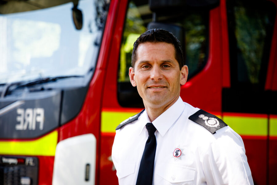 Chief Fire Officer Matt Cook stood in front of fire engine