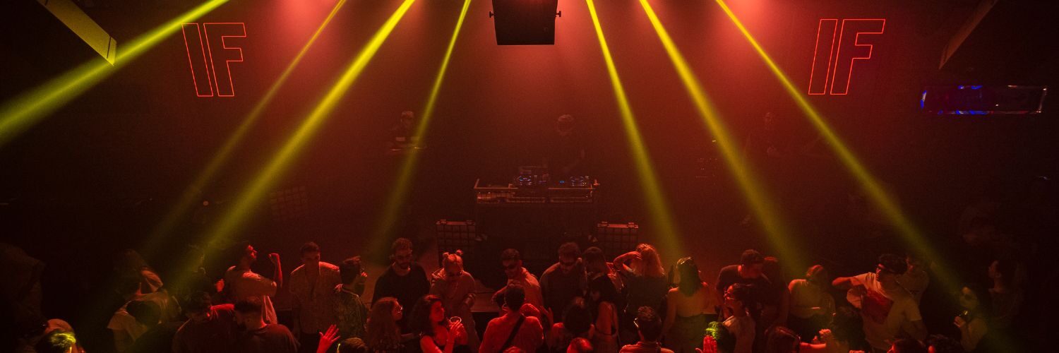 Image of people dancing in a nightclub