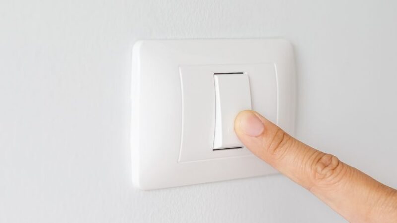 Image of a finger turning off lights