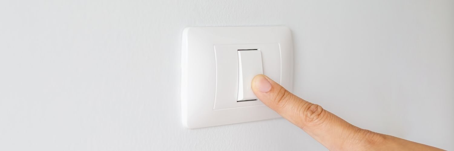 Image of a finger turning off lights