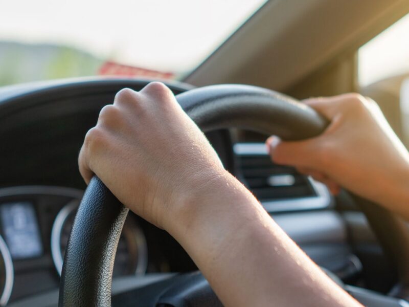 image of two hands holding a steering wheel